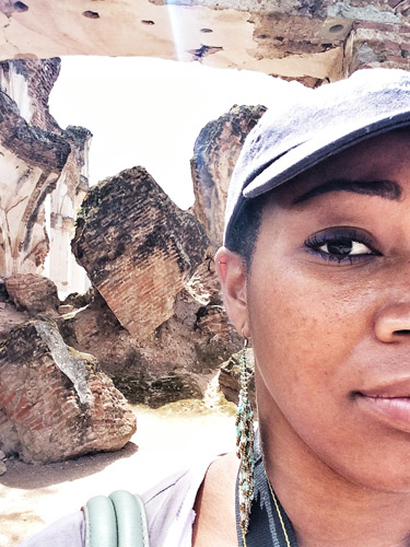 Selfie with immense La Recolección ruins in the background.
