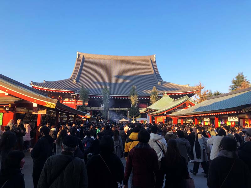 crowd with temple in background