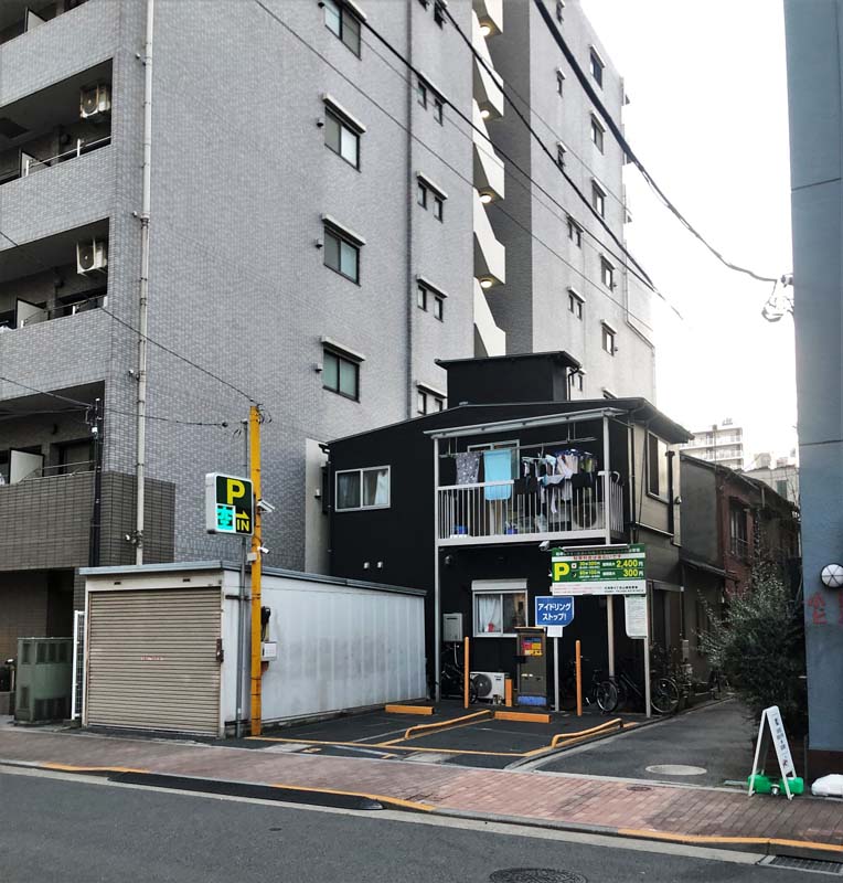 multi-story building next to two-story building