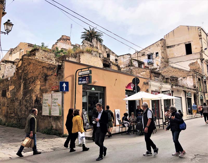 street scene with crumbling buildings in background