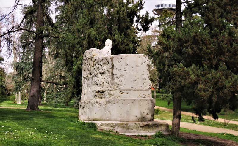 view of back of statue showing bullet holes