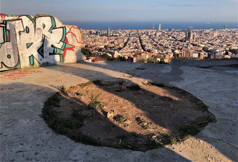 concrete bunker with graffiti overlooking city