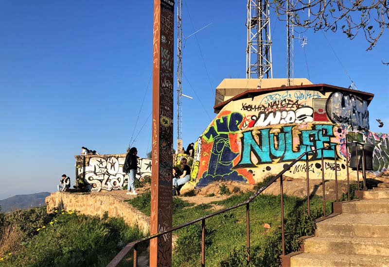 graffiti-covered concrete bunkers on top of hill