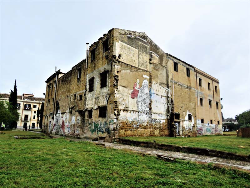 crumbling brick building with graffiti