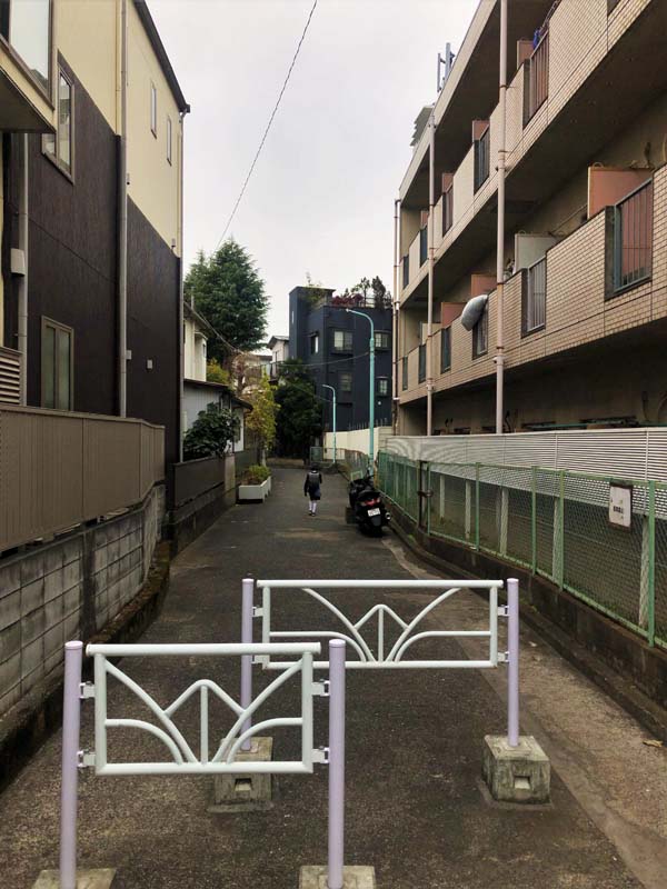 walkway with painted metal structures