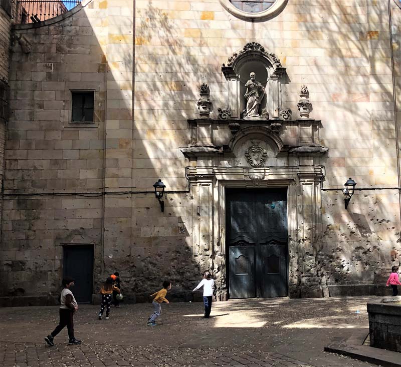 children play outside church