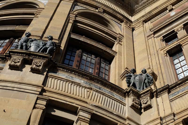 Sculptures adorn a building with intricate carvings 