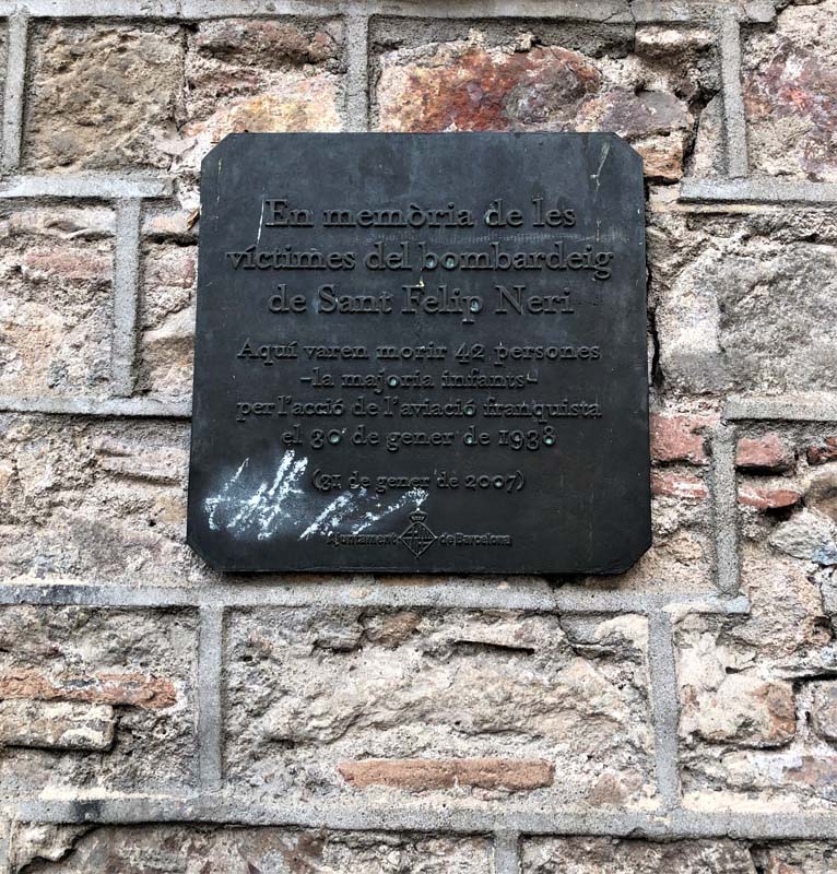 dark metal plaque on stonework wall