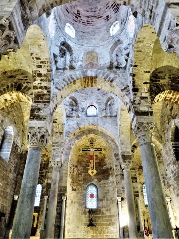 view looking up at apse and brickwork arches