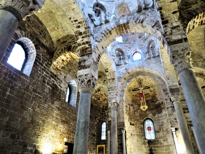 brickwork interior of church with Corinthian columns and arches