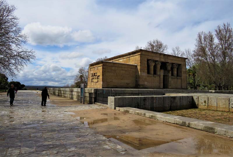 temple with two people on paved walkway