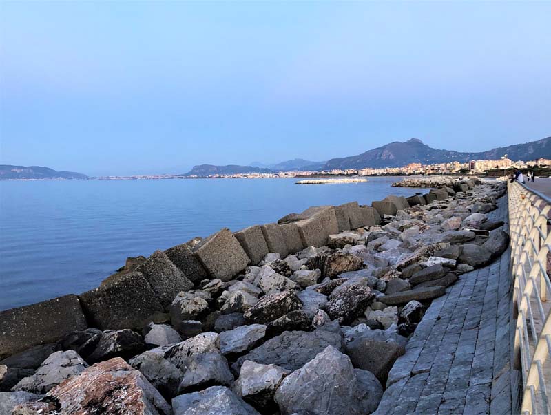 view of ocean from walkway with stone border