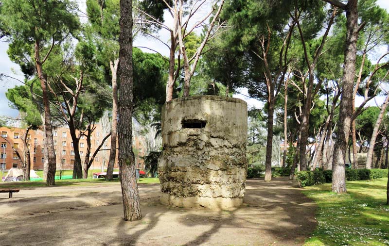 deteriorating bunker among trees