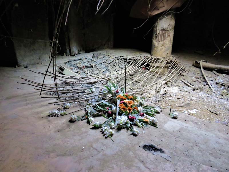 pile of flowers on floor with dust and rebar