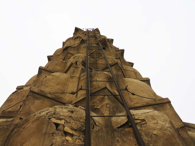 steel ladder leads to the top of exterior of muqarnas dome