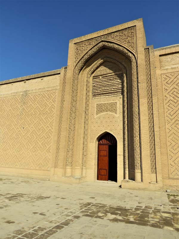 iwan with pointed arch and ornate brickwork