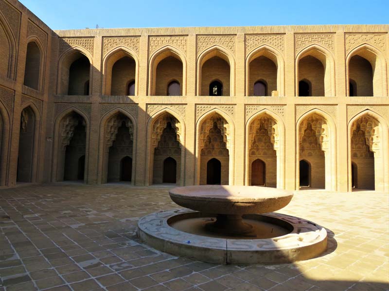 view of fountain in courtyard with double arcade 