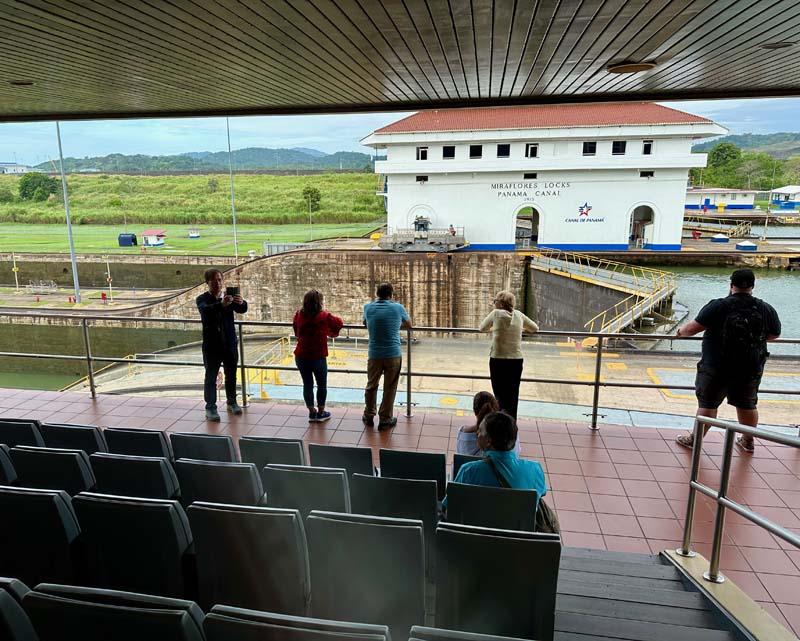 people on platform observing a lock