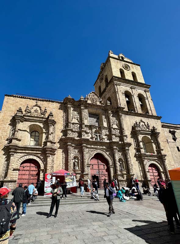 people gather on steps and in plaza