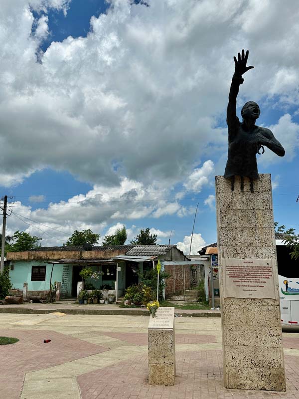 Figure 18 monument with figure of man reaching to the sky
