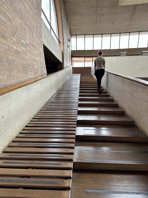 Schentag walks up wooden staircase