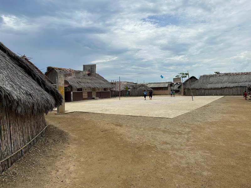 central court surrounded by huts