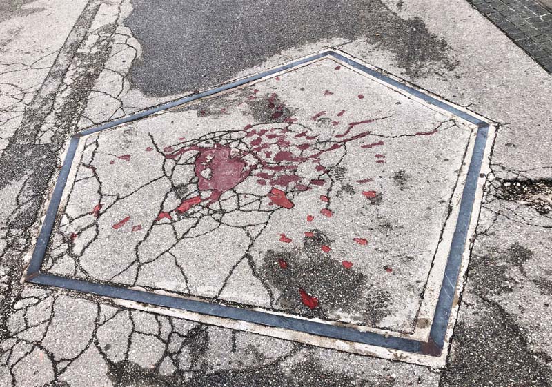 red splatter on concrete