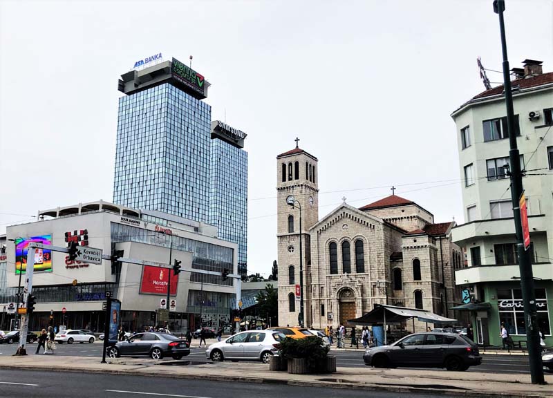 street scene with church and modern buildings