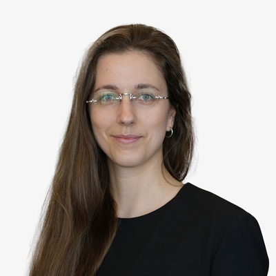 Krista Reimer, a woman with long brown hair and glasses