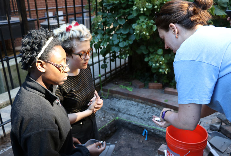 Rebecca Graff with two students