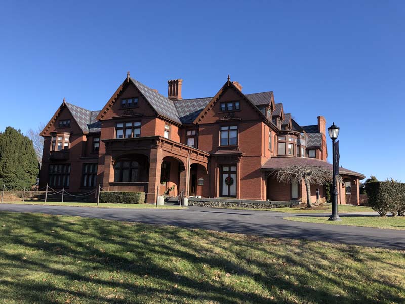 red brick house with driveway