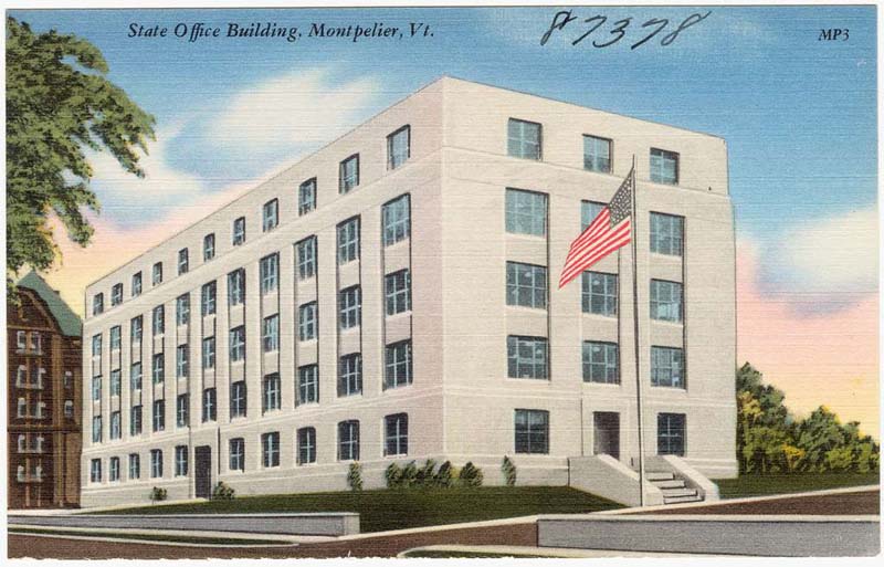 postcard of five-story white government building