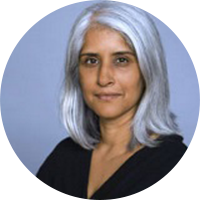 Woman with long silver hair and black shirt