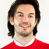 Man with black hair and red sweater