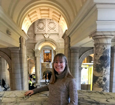 Ashley posed inside marble building