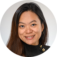 Asian woman with long brown hair and black shirt