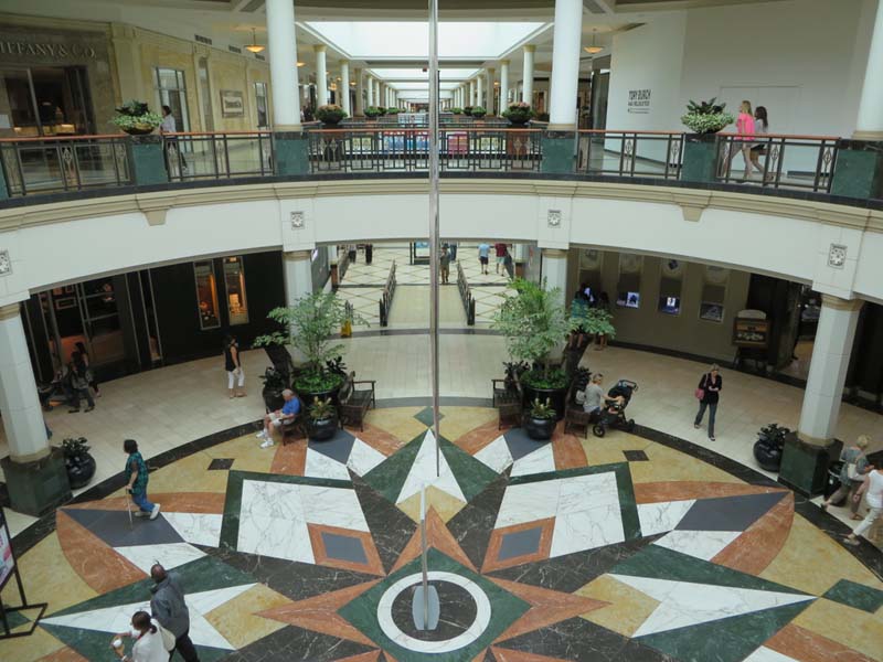 view of mosaic floor from second floor of two-story atrium