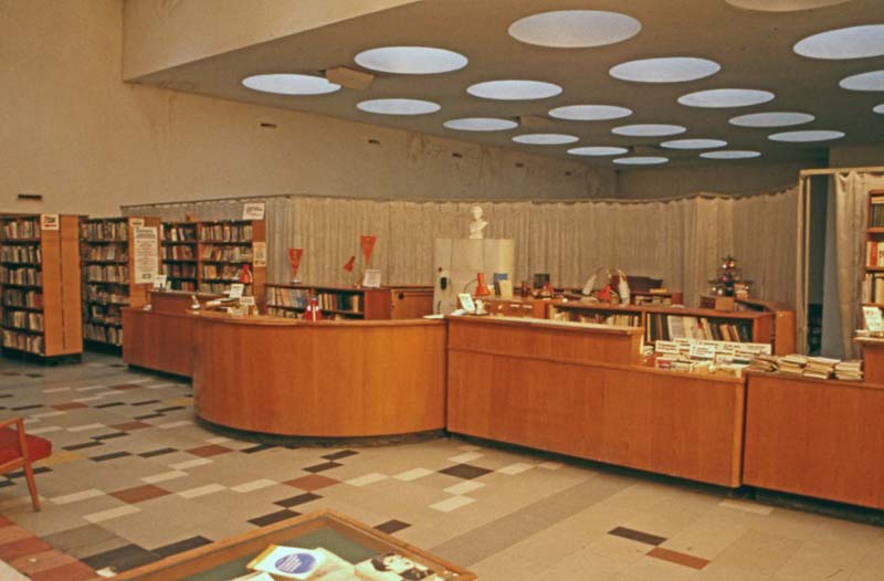 library interior with reference desk and bookshelves