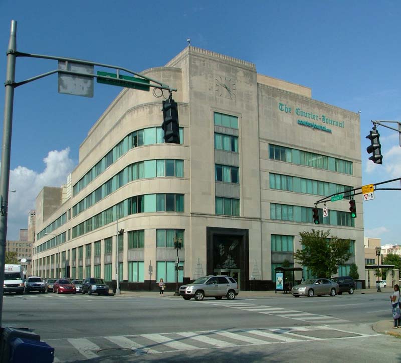 muti-story stone building on street corner