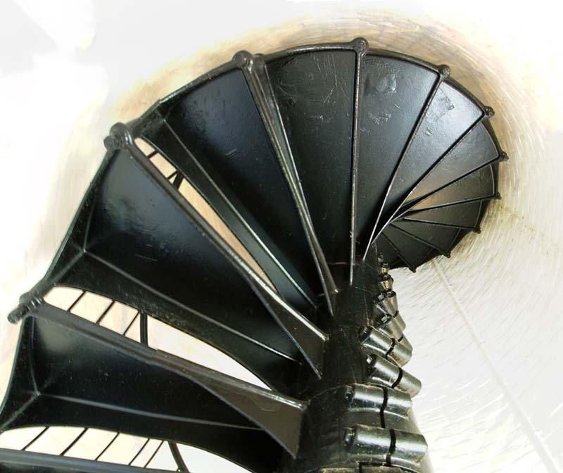 view from below of metal spiral staircase