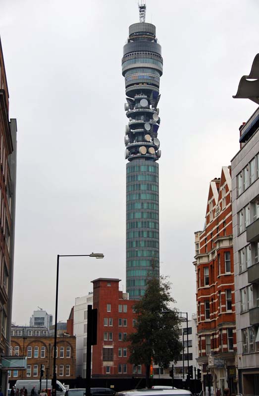 radio tower with glass windows overlooking city