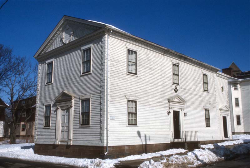 white building with wooden siding