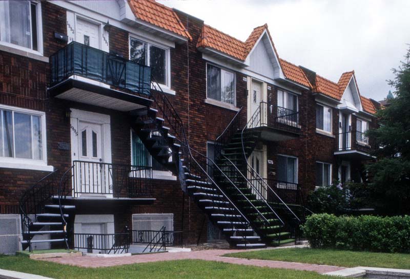 two-story brick building with staircase