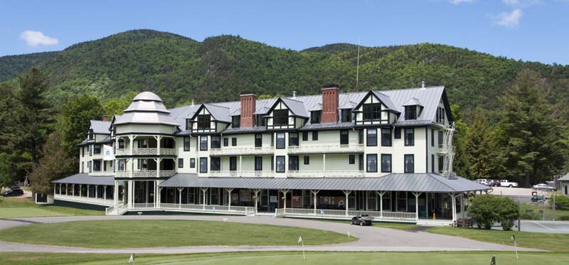 four-story building with wraparound porch