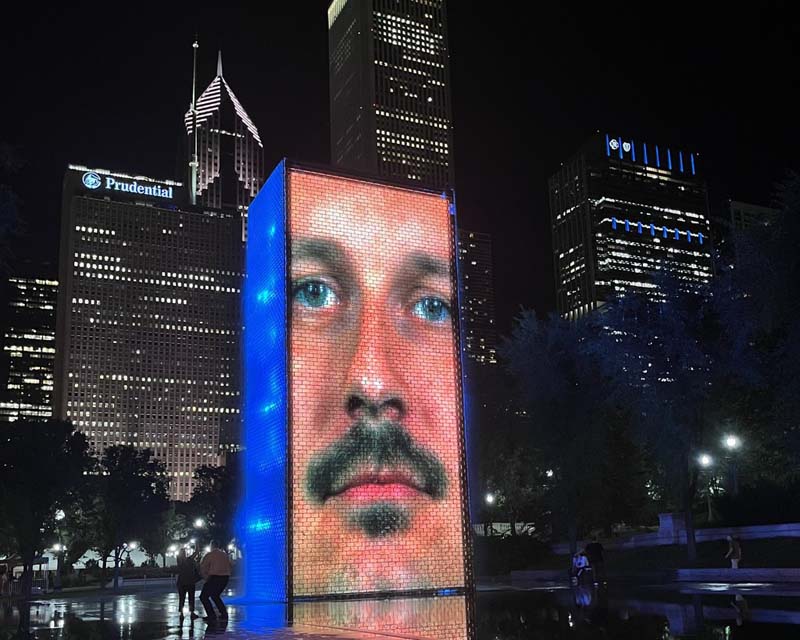 public art projection with skyline in background