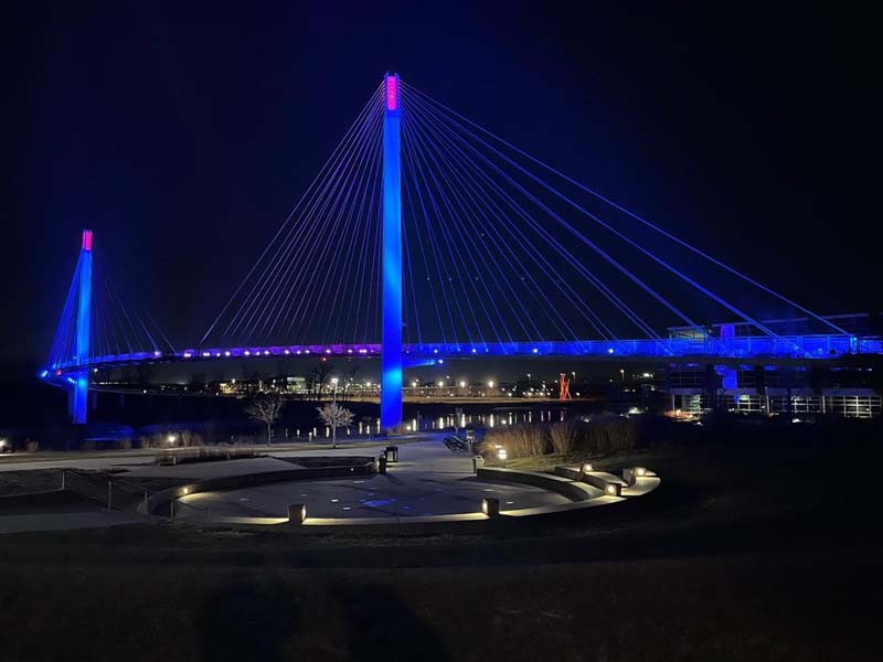 suspension bridge lit up at night