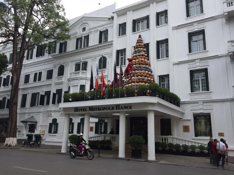 a white building with architectural features reminiscent of the federal style