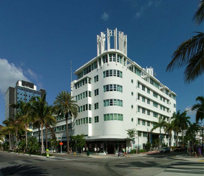 A white building with a curved corner façade