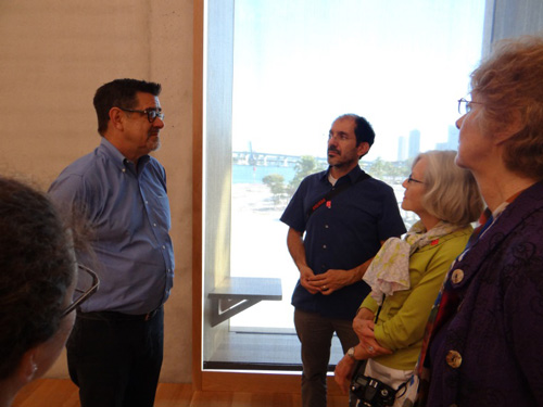 Figure 6 - SAH tour group touring PAMM in front of window with view to Bayfront Park and the Port of Miami