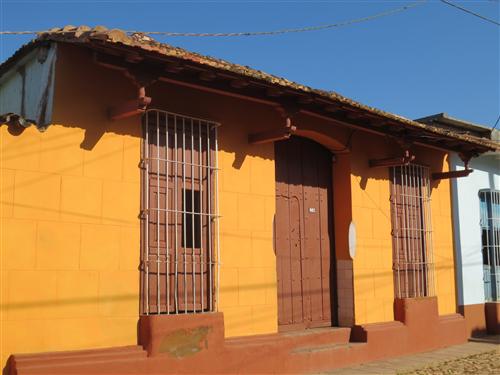 House with decoratively carved roof rafters